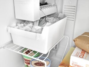 Refrigerators with integral ice makers